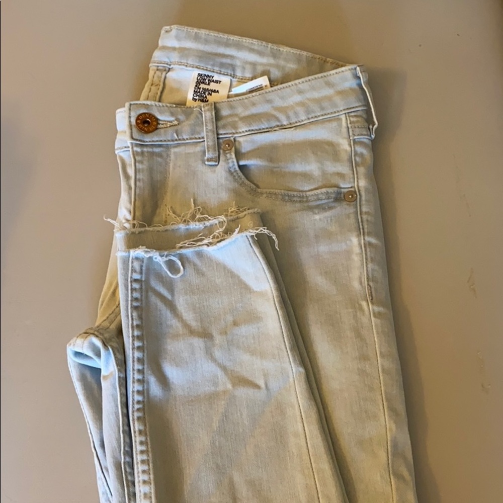 Light wash frayed bottom jeans